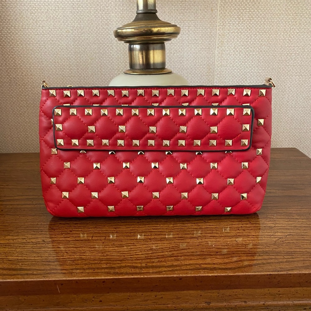 Valentino style red rockstud clutch.